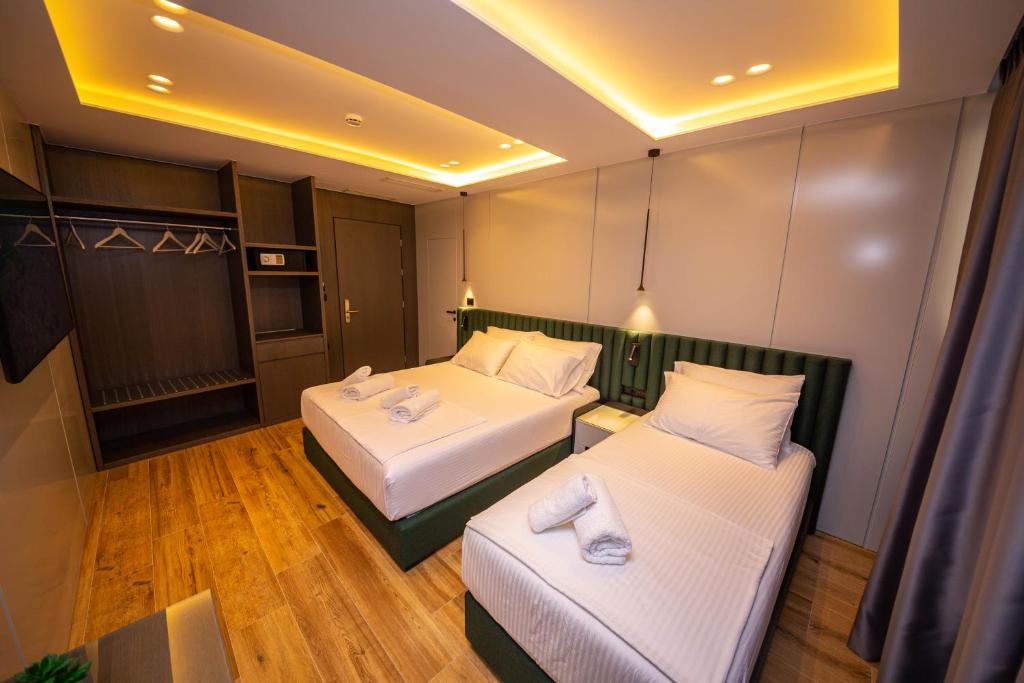 Postel nebo postele na pokoji v ubytování Hotel Lili-1