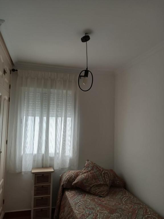 Łóżko lub łóżka w pokoju w obiekcie C/ Cartaya 11