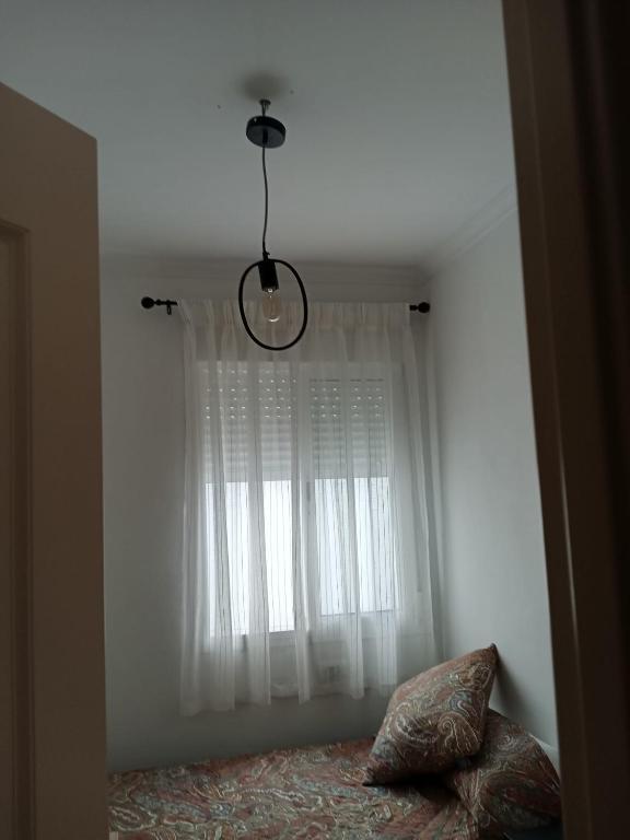 Łóżko lub łóżka w pokoju w obiekcie C/ Cartaya 11