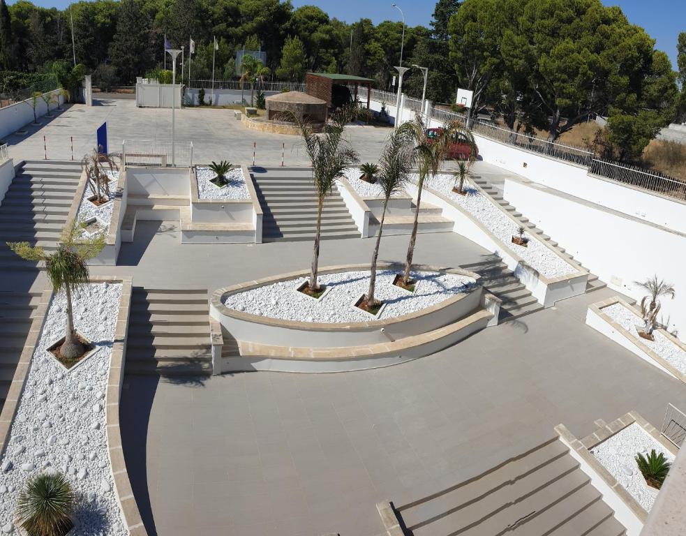 an empty skate park with palm trees and stairs at Ritò in Gallipoli