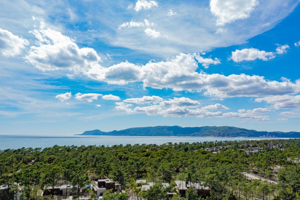 an aerial view of a city and the water at Pestana Troia Eco-Resort & Residences in Troia