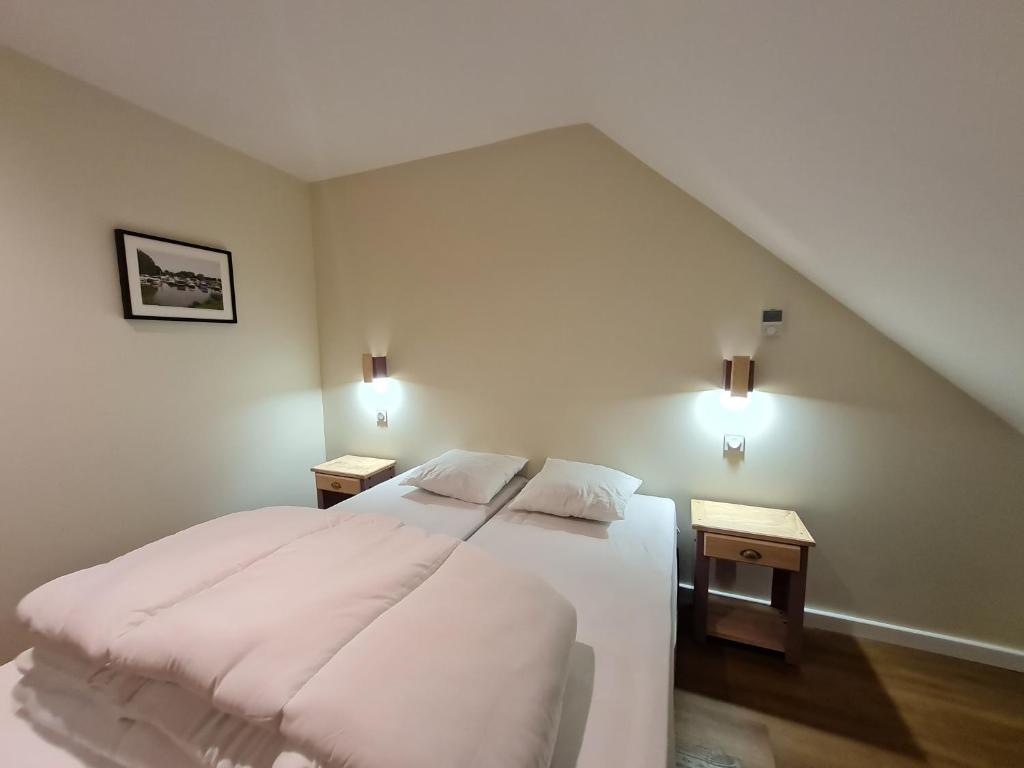 Postel nebo postele na pokoji v ubytování Le Faubourg - Gîte et chambres d'hôte
