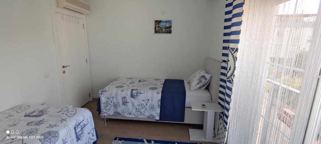 Postel nebo postele na pokoji v ubytování Family Apart-Hotel ''2022''- 5