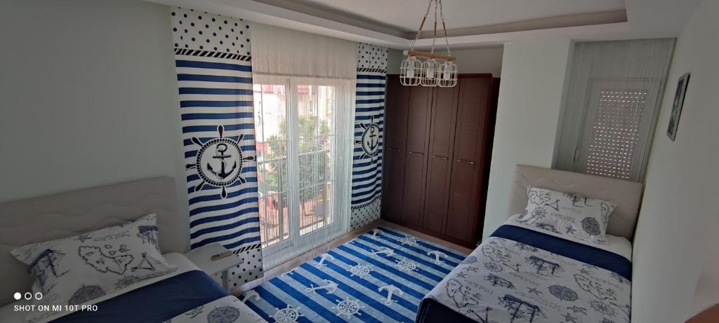 Postel nebo postele na pokoji v ubytování Family Apart-Hotel ''2022''- 5