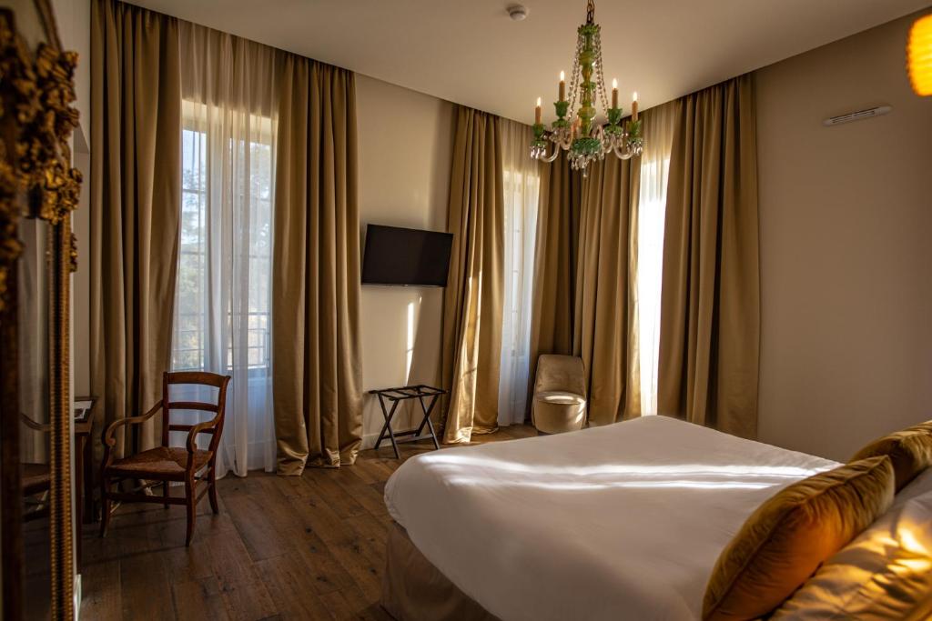Postel nebo postele na pokoji v ubytování Hôtel Villa Walbaum