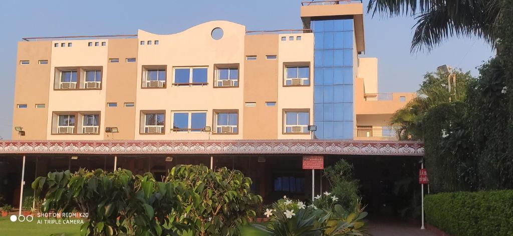 a building with a lot of windows on it at Ruchishree Garden in Ujjain
