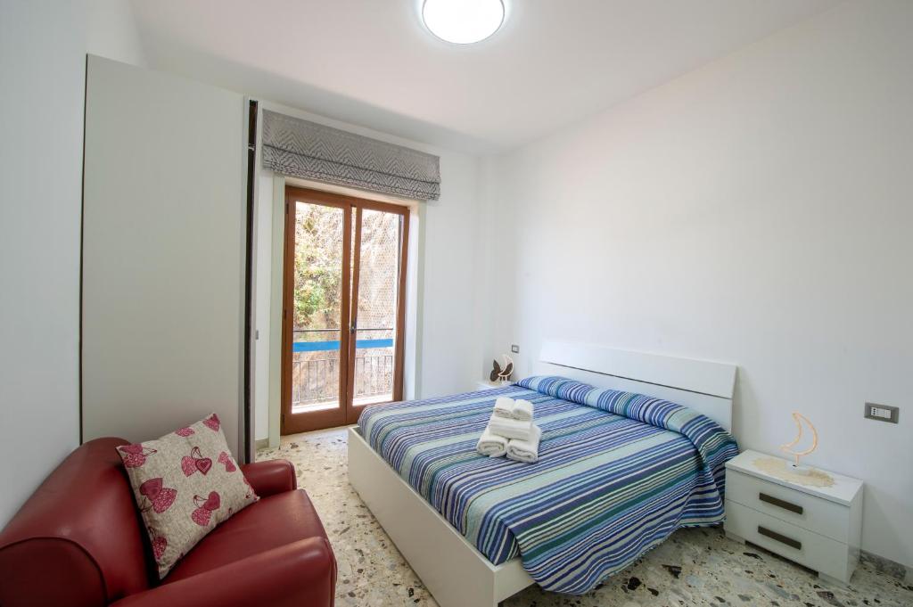Кровать или кровати в номере Lily House Amalfi