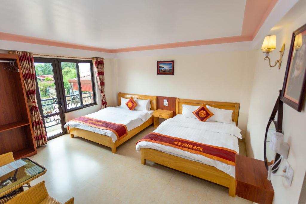 Postel nebo postele na pokoji v ubytování Minh Thanh Sa Pa Hotel