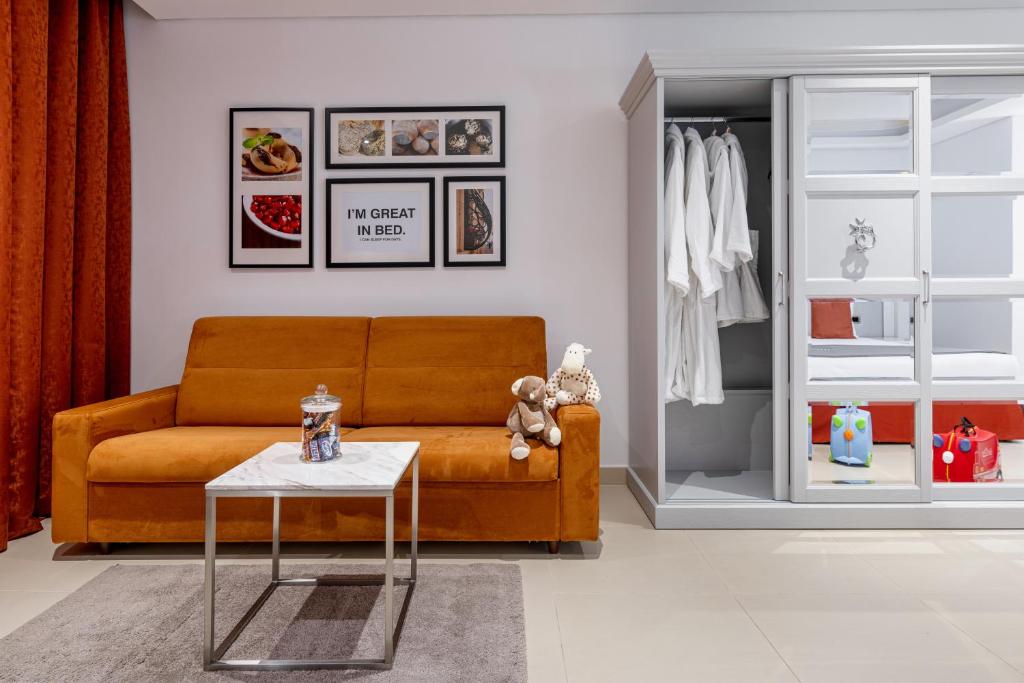a living room with a couch and a table at AX The Palace in Sliema