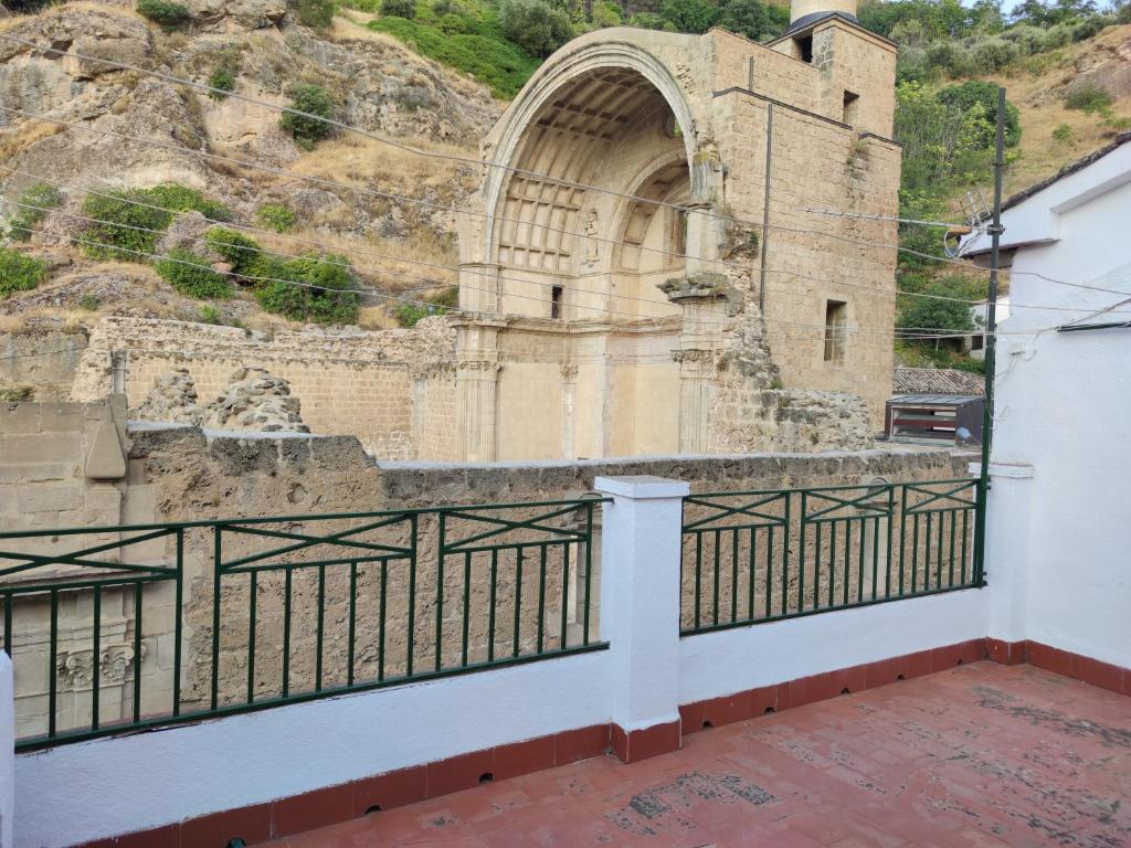 an old building with a fence in front of it at Casa Ventana Cazorla in Cazorla