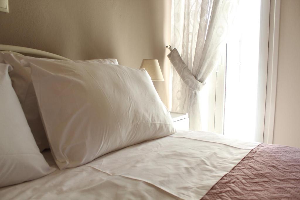 Posteľ alebo postele v izbe v ubytovaní Dimokritos Apartment