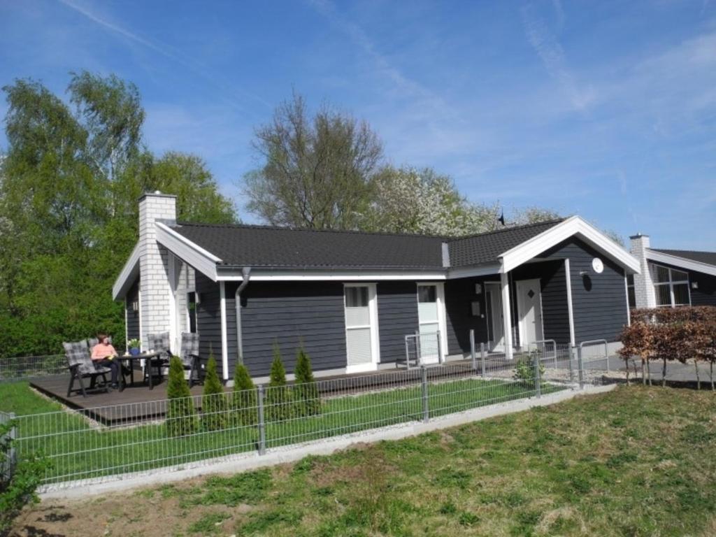 a home with a black and white house at Haus Stressfrei - Nordhorn in Nordhorn
