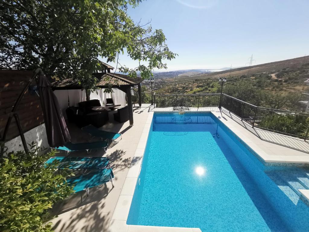 a swimming pool in a villa with a view at Villa Diamond in Žrnovnica
