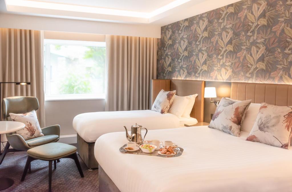 Postel nebo postele na pokoji v ubytování Hotel Kilkenny