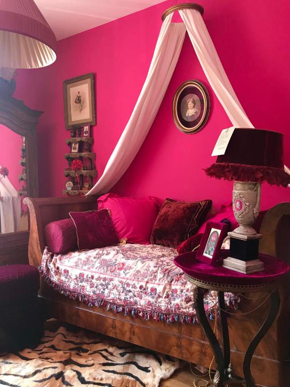 Posteľ alebo postele v izbe v ubytovaní La Maison des Roses