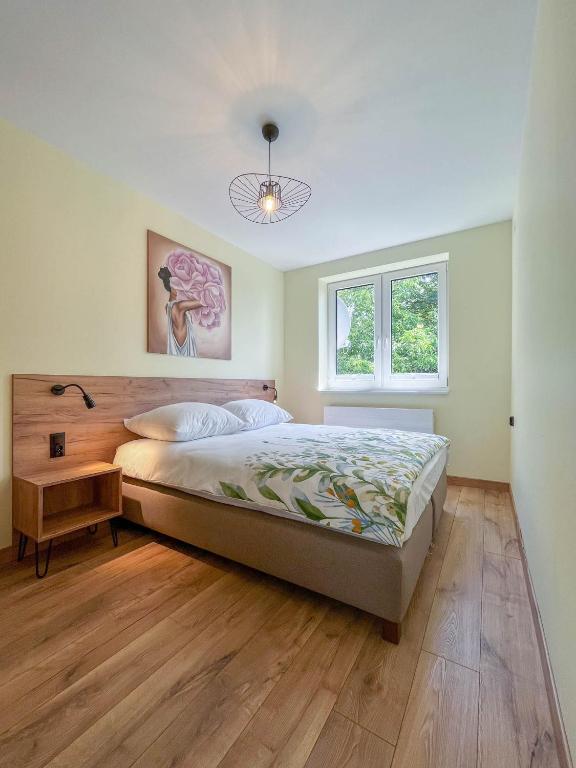 Posteľ alebo postele v izbe v ubytovaní Apartament Ptasi Śpiew