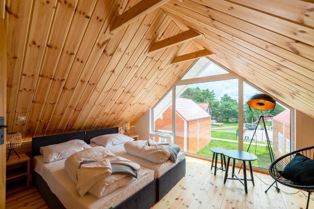 Postel nebo postele na pokoji v ubytování Domki Mewa