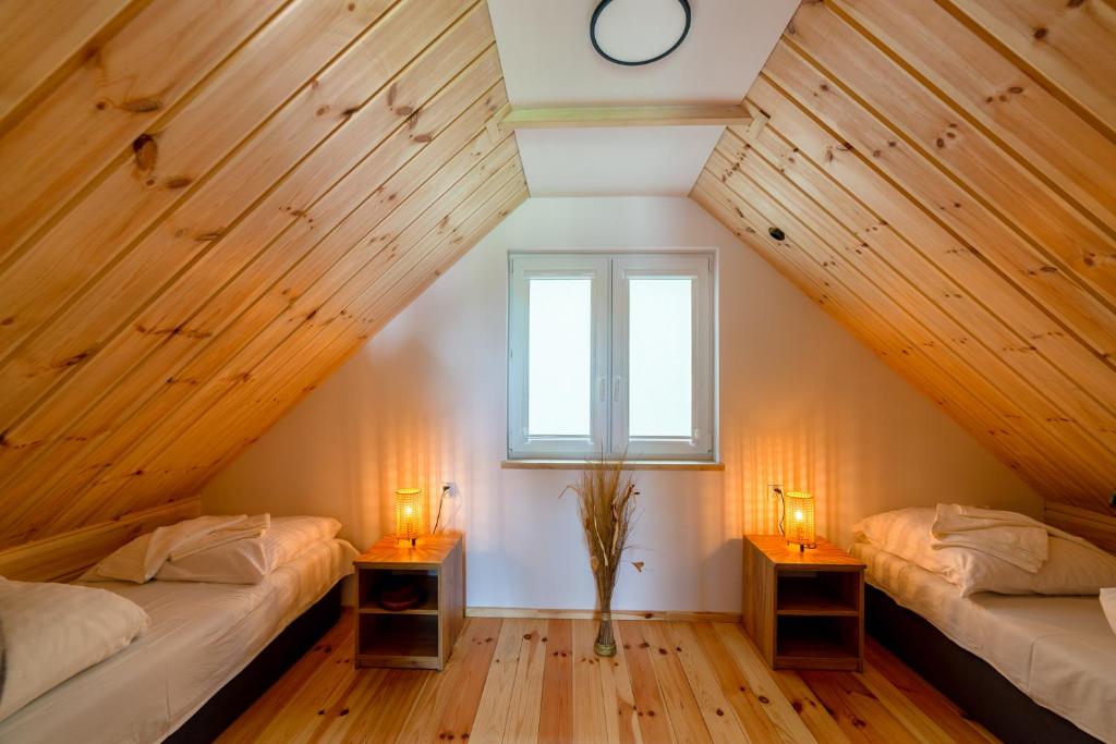 Postel nebo postele na pokoji v ubytování Domki Mewa