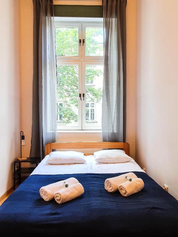 Posteľ alebo postele v izbe v ubytovaní Classic apartments Pilsudskiego street