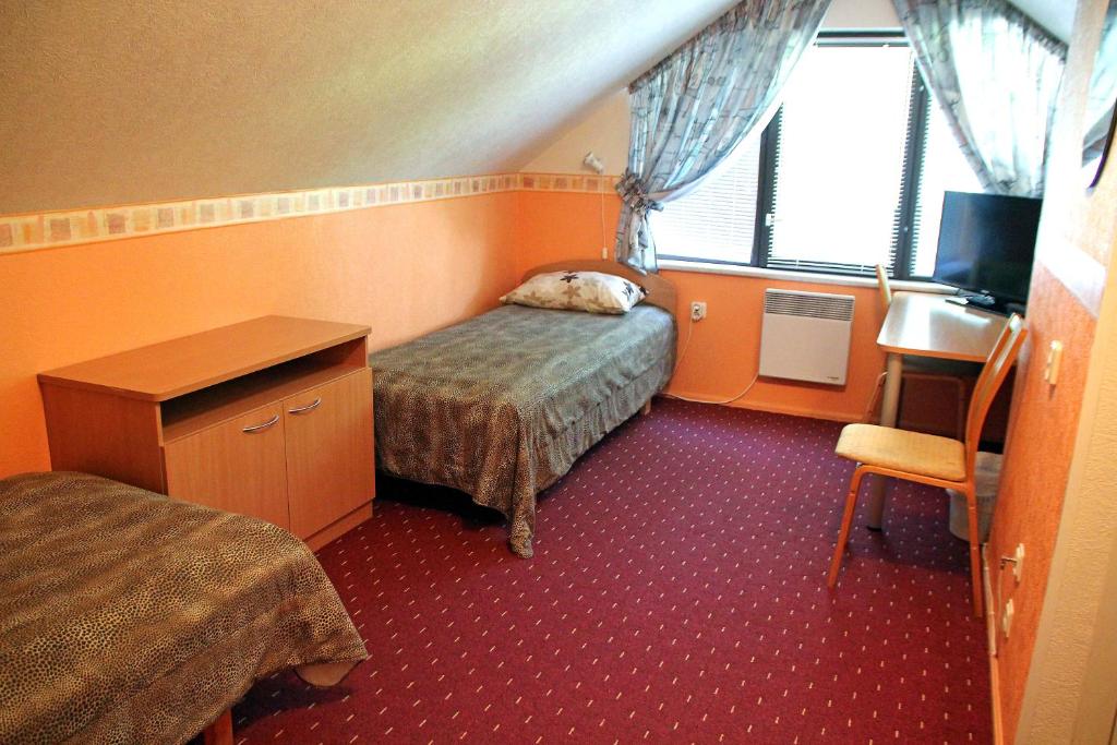 Postel nebo postele na pokoji v ubytování Rivaal Guesthouse-Cafe