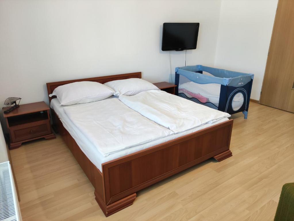 Postel nebo postele na pokoji v ubytování U Končoka