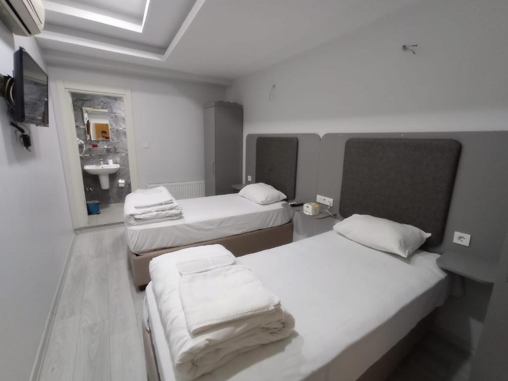 Postel nebo postele na pokoji v ubytování Emin Konak Hotel