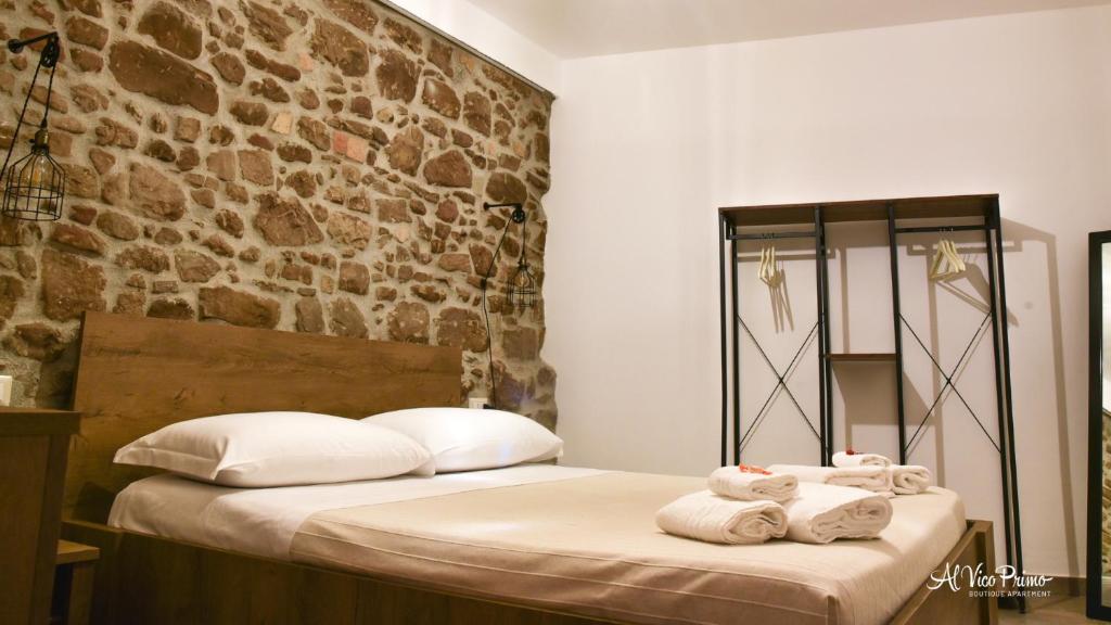 A bed or beds in a room at Al Vico Primo - Boutique Apartment
