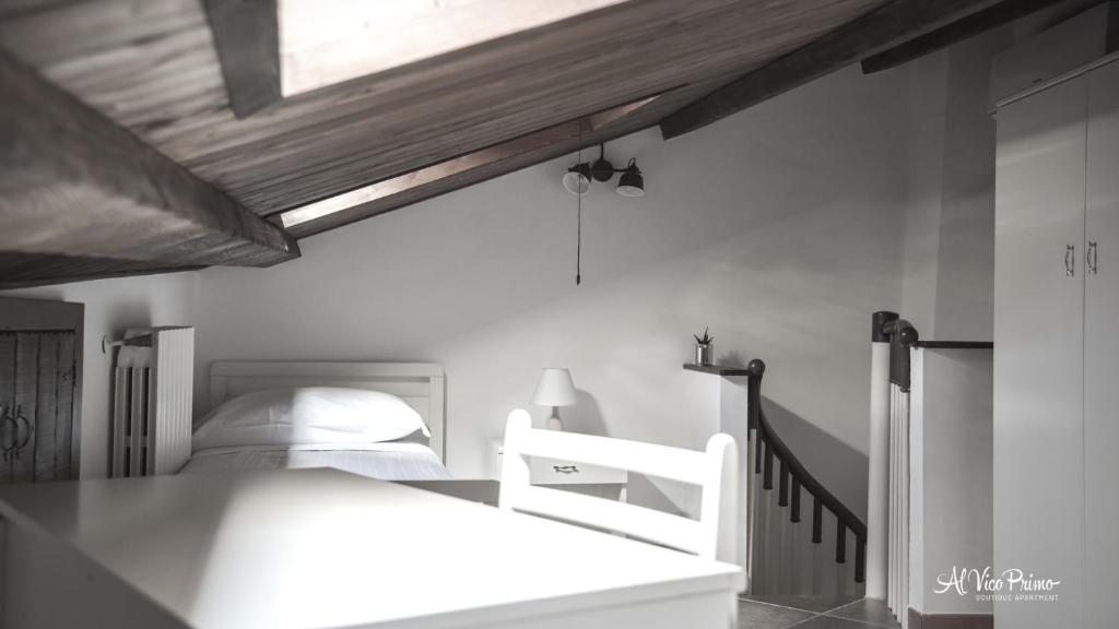 A bed or beds in a room at Al Vico Primo - Boutique Apartment