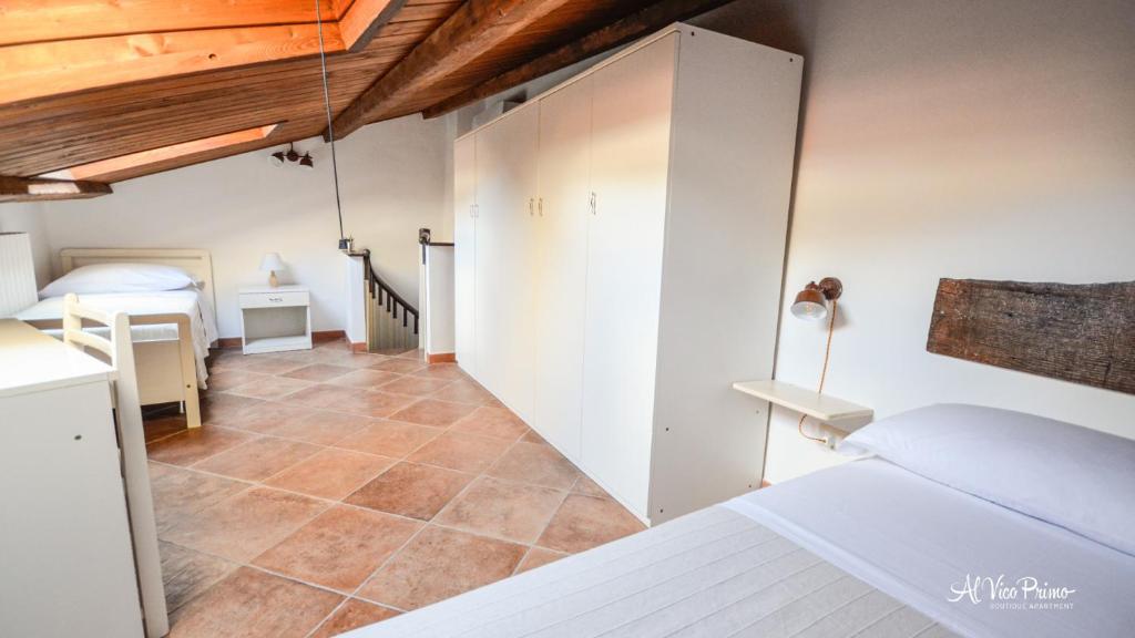 A bed or beds in a room at Al Vico Primo - Boutique Apartment