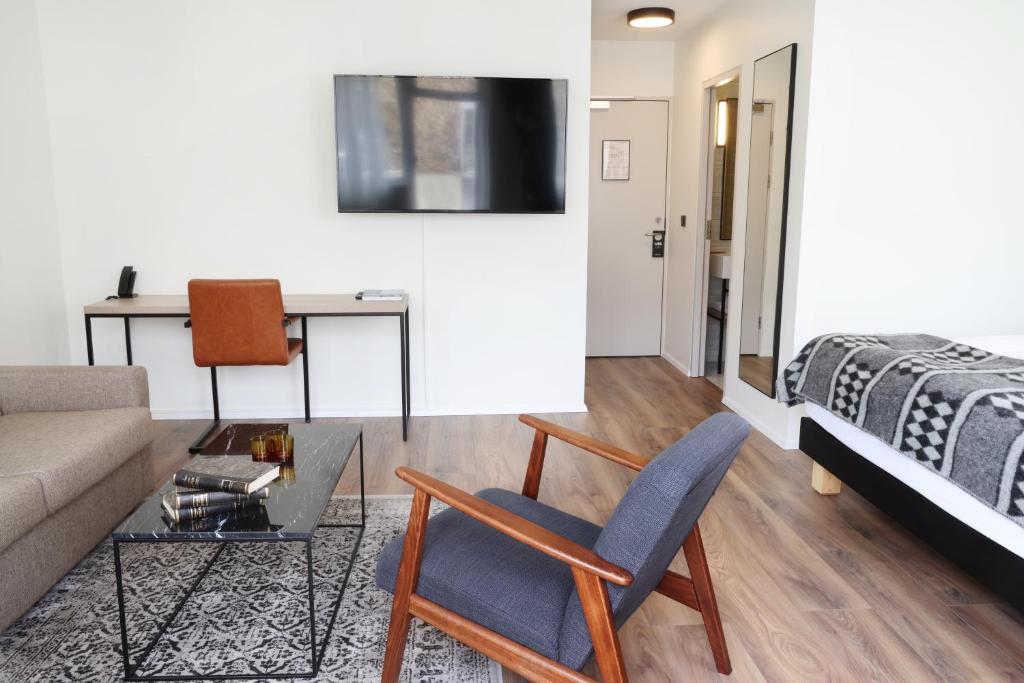 TV a/nebo společenská místnost v ubytování Fosshotel Lind