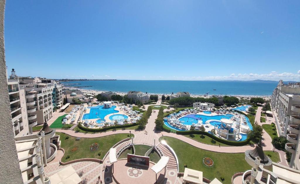 an aerial view of a resort with swimming pools at Апартамент Сънсет Ризорт in Pomorie