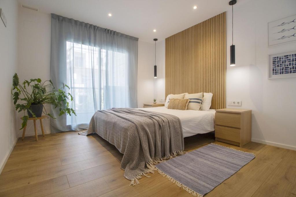 Postel nebo postele na pokoji v ubytování Vivalidays Apartour - Calella