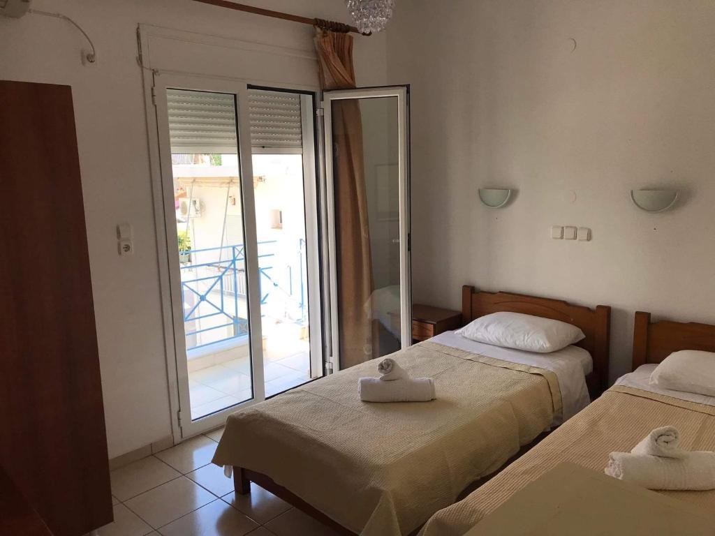 Postel nebo postele na pokoji v ubytování Αγνάντι ενοικιαζόμενα δωμάτια