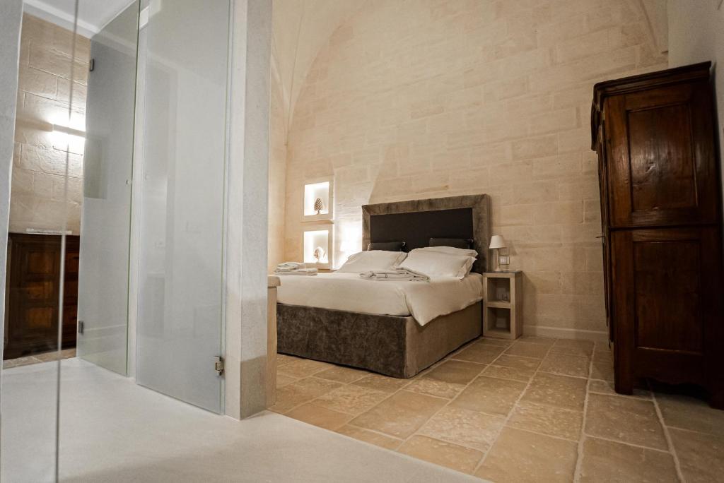 Postel nebo postele na pokoji v ubytování Masseria Torleanzi Wine Relais