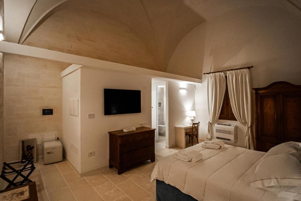 TV a/nebo společenská místnost v ubytování Masseria Torleanzi Wine Relais