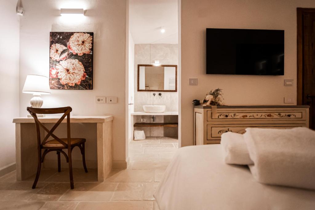 Postel nebo postele na pokoji v ubytování Masseria Torleanzi Wine Relais