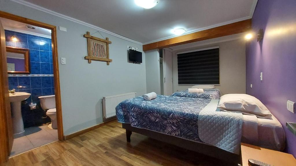 Postel nebo postele na pokoji v ubytování Hostal La Base