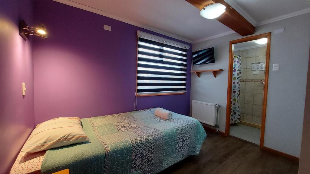 Postel nebo postele na pokoji v ubytování Hostal La Base
