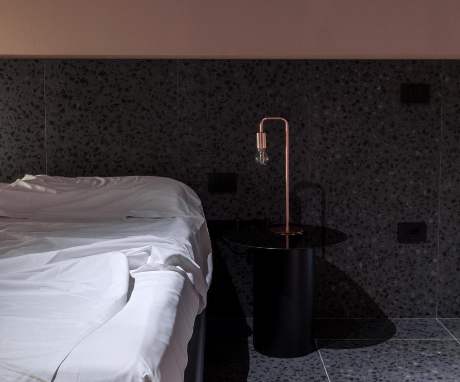 Postel nebo postele na pokoji v ubytování Elide Design Hotel