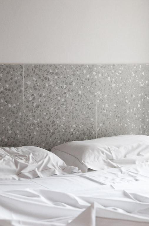 Postel nebo postele na pokoji v ubytování Elide Design Hotel