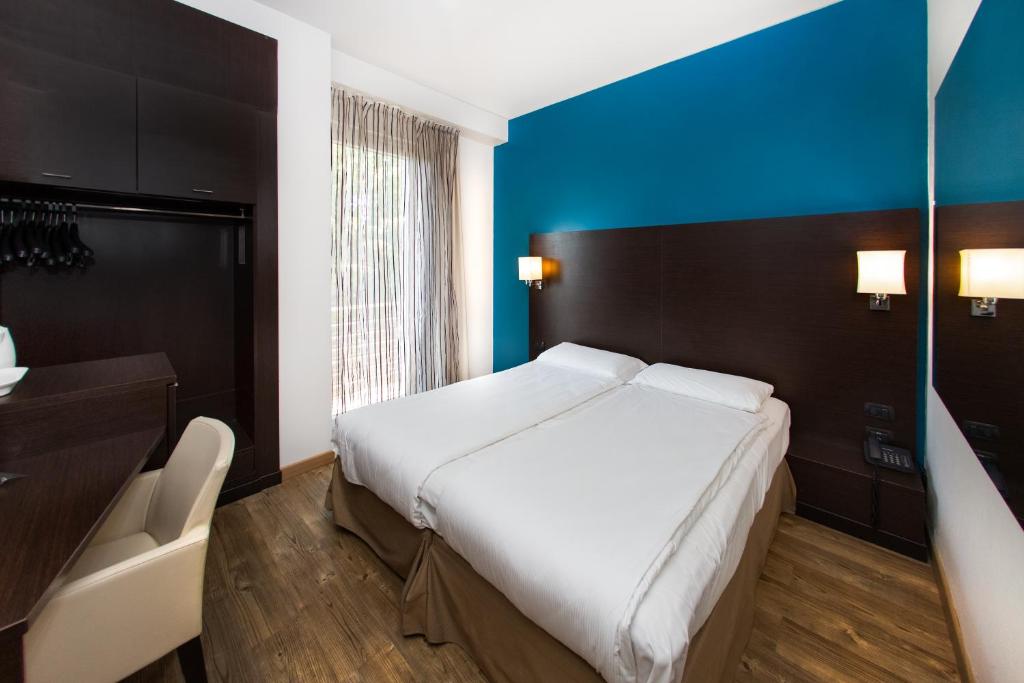 Postel nebo postele na pokoji v ubytování Hotel Bonotto
