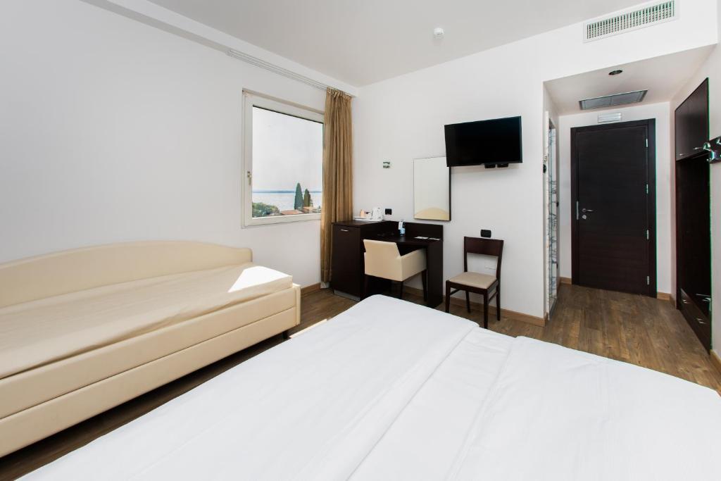 Postel nebo postele na pokoji v ubytování Hotel Bonotto
