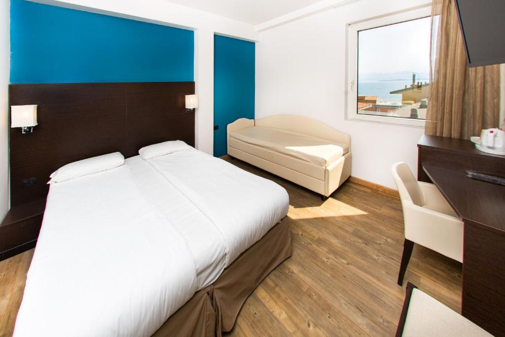 Postel nebo postele na pokoji v ubytování Hotel Bonotto