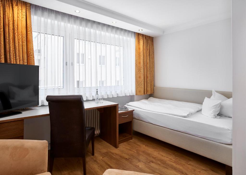 Postel nebo postele na pokoji v ubytování Hotel Kraft