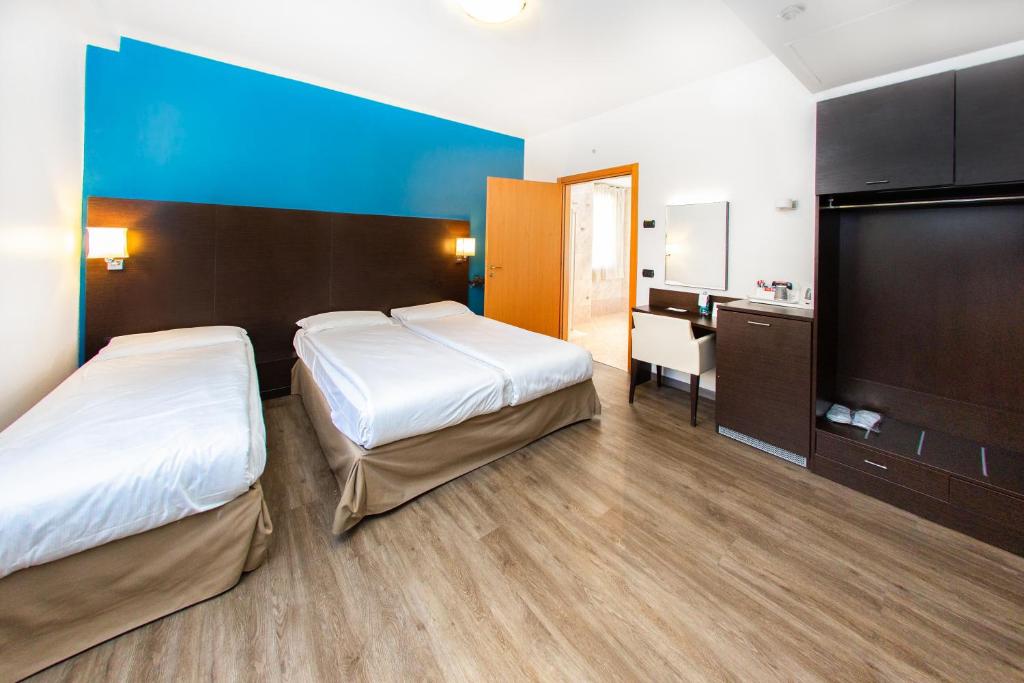 Postel nebo postele na pokoji v ubytování Hotel Bonotto