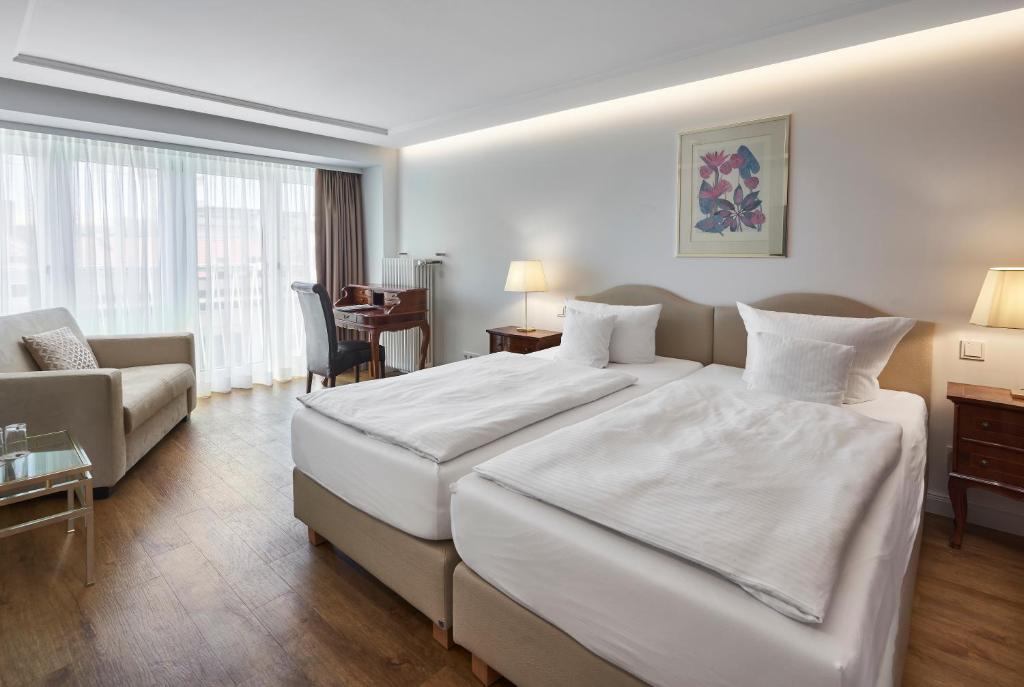 Postel nebo postele na pokoji v ubytování Hotel Kraft