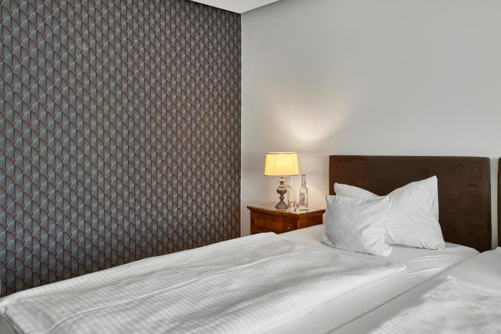 Postel nebo postele na pokoji v ubytování Hotel Kraft
