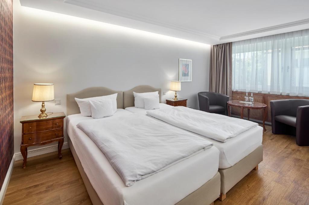 Postel nebo postele na pokoji v ubytování Hotel Kraft