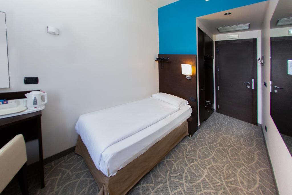 Postel nebo postele na pokoji v ubytování Hotel Bonotto