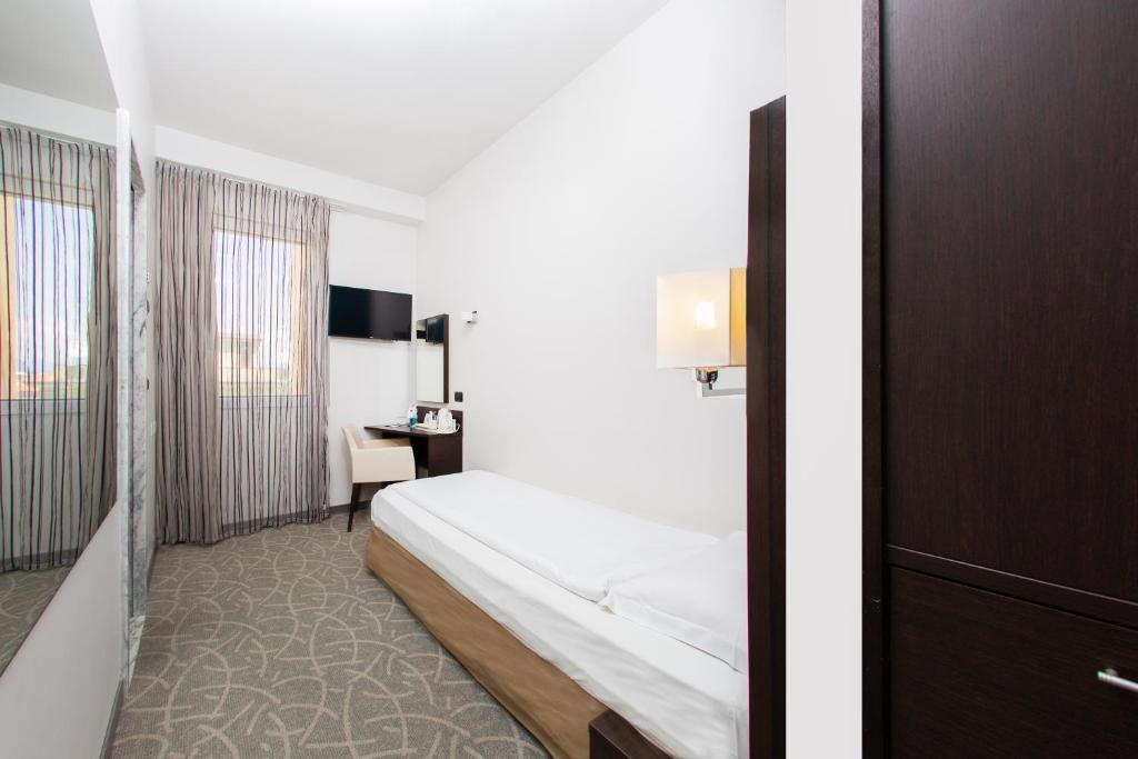Postel nebo postele na pokoji v ubytování Hotel Bonotto